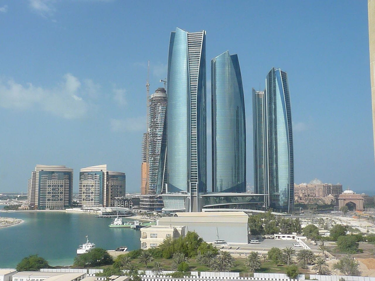 Curved glass towers reflecting the sky, Abu Dhabi.